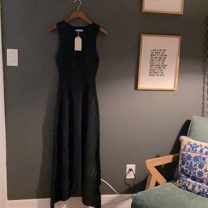 Never worn. Black sleeveless knit midi/maxi dress with separate lining piece
